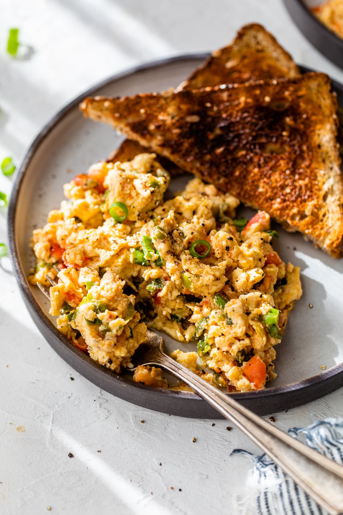 Huevos pericos on plate with fork and toast