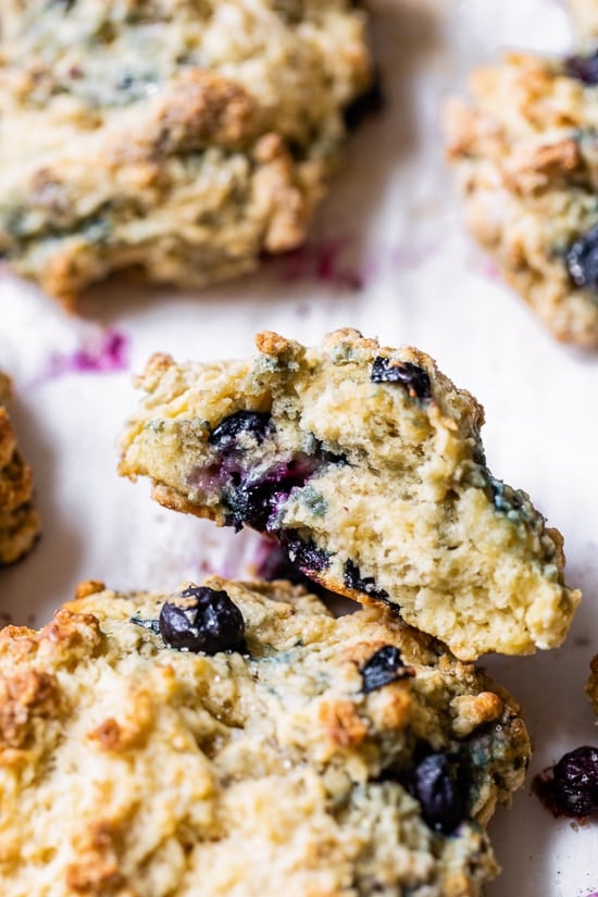 Two blueberry scones, one cut in half.