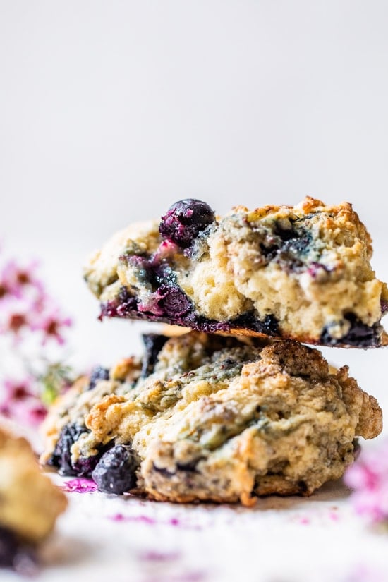 Two blueberry scones stacked on top of each other.