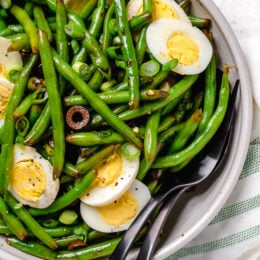 Green bean salad with olives and hard-boiled eggs.