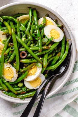 Green bean salad with olives and hard-boiled eggs.
