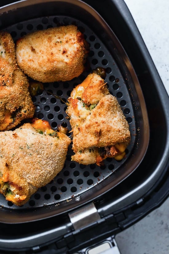 Broccoli and Cheese Stuffed Chicken is filled with cheddar and broccoli, then rolled up, breaded and baked in the oven or air fryer!
