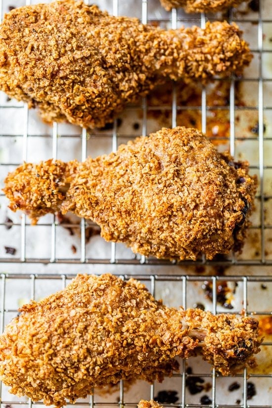 This healthy oven fried chicken is moist on the inside, golden and extra crispy on the outside thanks to a secret ingredient: bran flakes! Crispy oven fried chicken drumsticks.