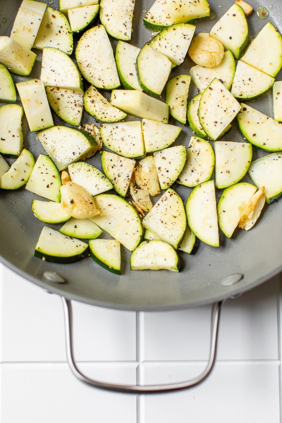 zucchini in a grey skillet
