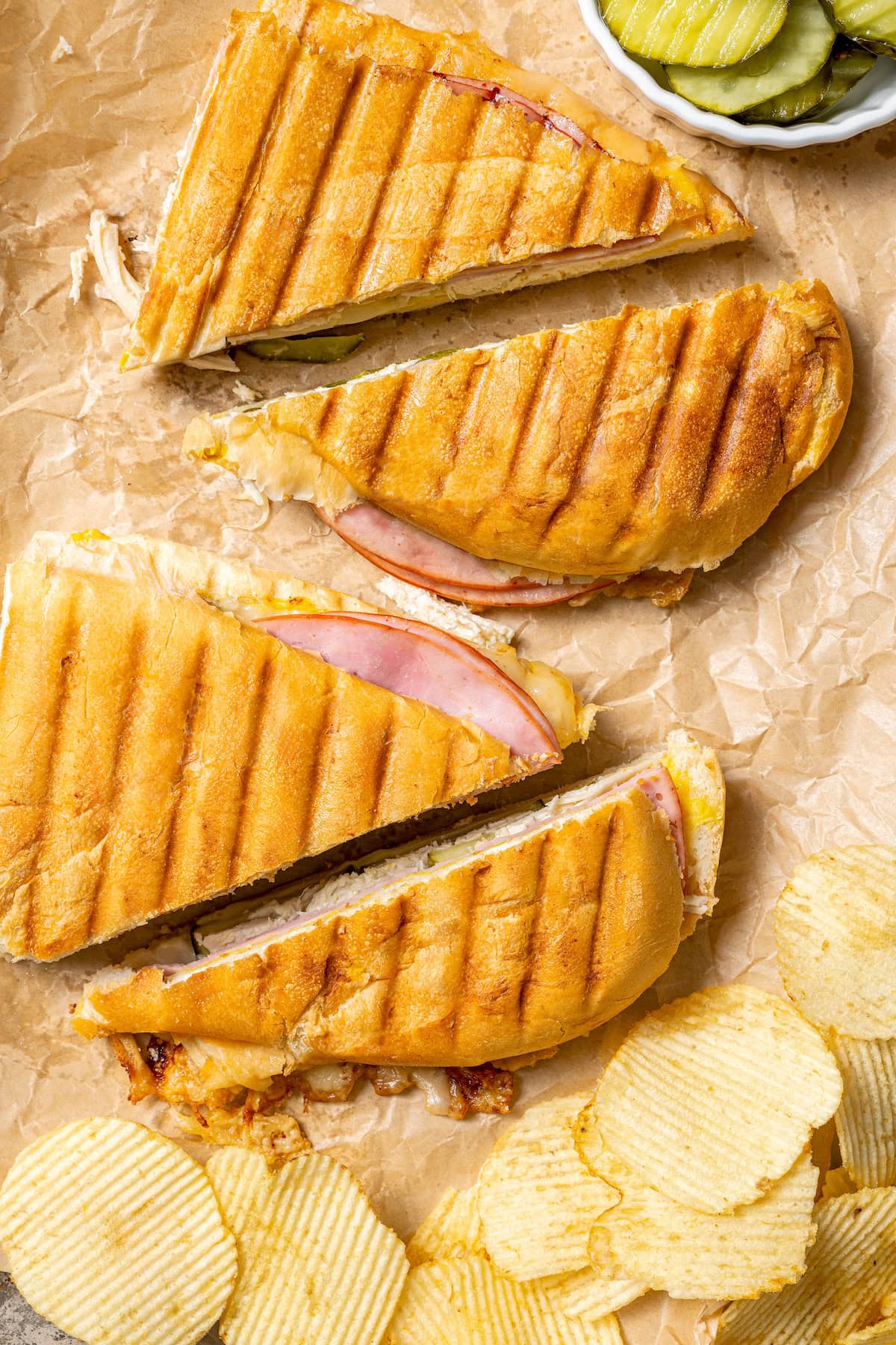 This turkey Cuban sandwich is an easy way to put those Thanksgiving leftovers to use, and my lightened up recipe won’t weigh you down either! 2 turkey Cuban sandwiches sliced in half