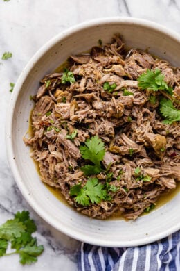 Bowl of slow cooker pork carnitas.