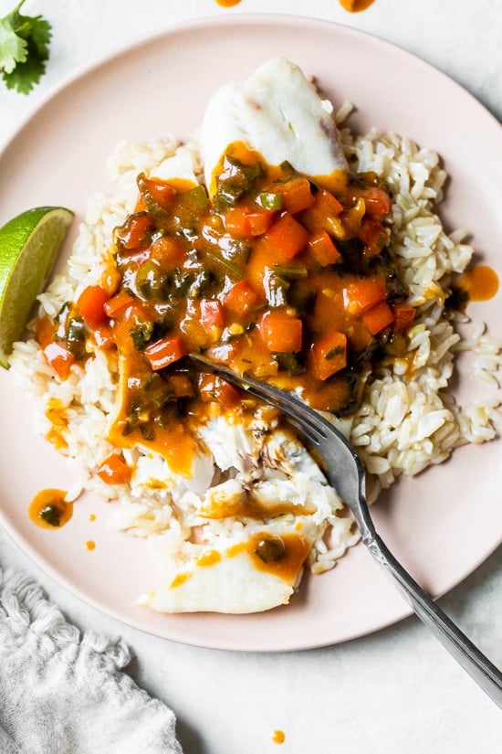 Broiled Tilapia with Thai Coconut Curry Sauce has so much flavor, perfect over jasmine rice to absorb all the delicious sauce.