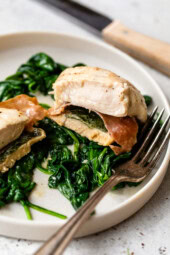 Chicken Saltimbocca with spinach on plate