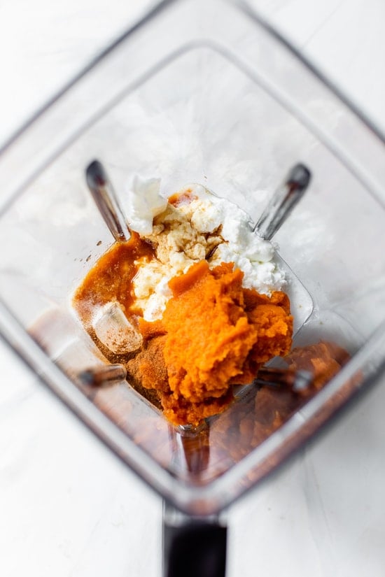 Made with Greek yogurt, pumpkin puree, and pumpkin pie spice, this Pumpkin Smoothie tastes just like a slice of pumpkin pie. Pumpkin smoothie ingredients in a blender