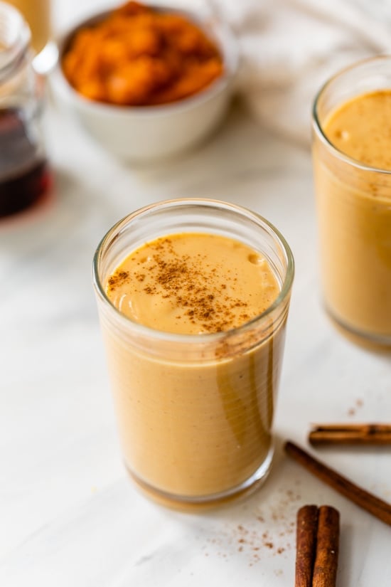 Made with Greek yogurt, pumpkin puree, and pumpkin pie spice, this Pumpkin Smoothie tastes just like a slice of pumpkin pie. A pumpkin pie smoothie in a glass