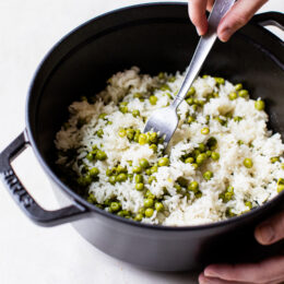 fluffing rice with a fork