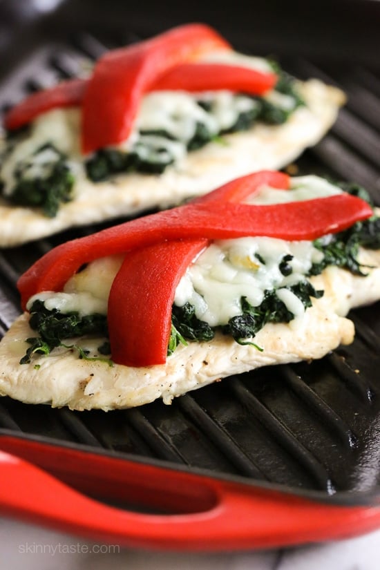 Grilled chicken topped with sauteed garlicky spinach, mozzarella and roasted peppers