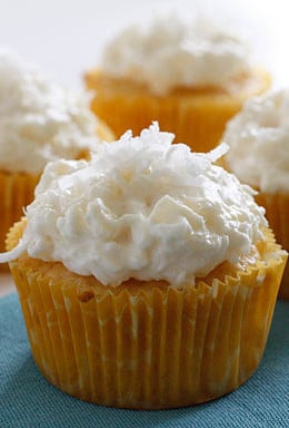 Pineapple and coconut top these light pineapple cupcakes, what a perfect Spring dessert! For the coconut lover out there, these are super easy, low fat, moist and delicious!