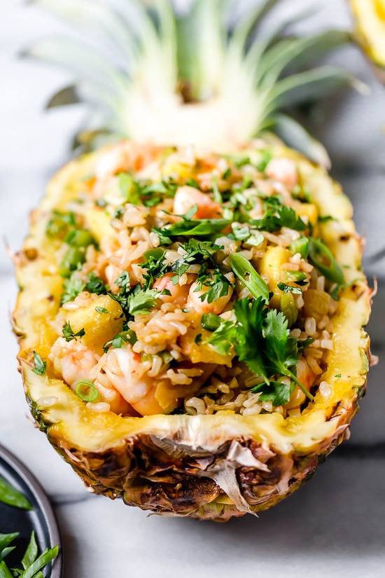 Pineapple Shrimp Fried Rice has a delicious flavor combination of savory, sweet and spicy. Serve it in hollowed out pineapples for a beautiful presentation!