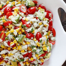 A wonderful summer salad made with lump crab meat, summer tomatoes, sweet charred roasted corn, cilantro, hot peppers and zesty lime juice. Serve this over mixed greens or tostadas as a main dish or you can put this in martini glasses as a fancy appetizer.