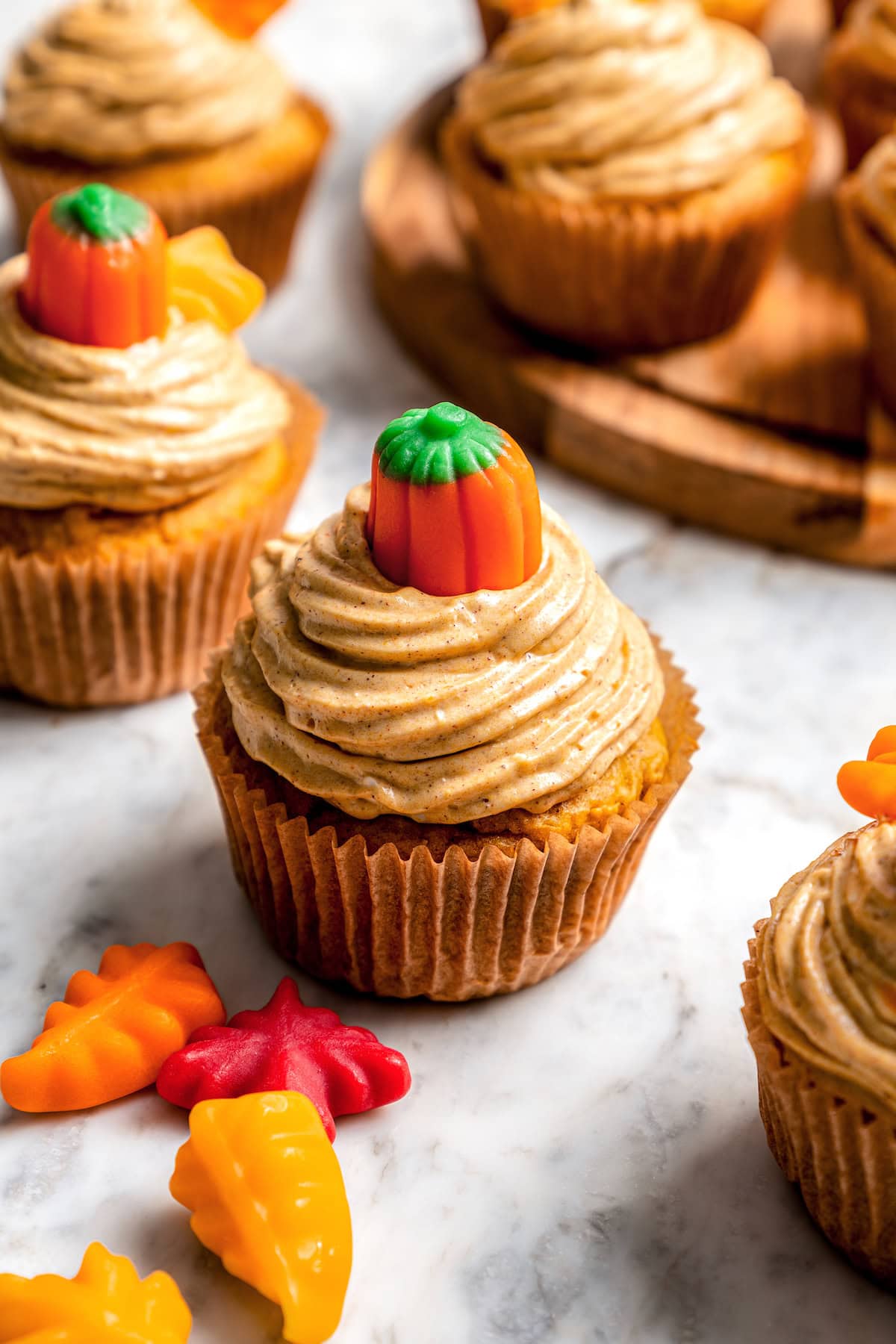 Boxed cake mix makes these pumpkin cupcakes easy to whip up for Halloween parties, Thanksgiving or anytime you want a cozy fall treat! Lightened up pumpkin cupcake with pumpkin cream cheese frosting