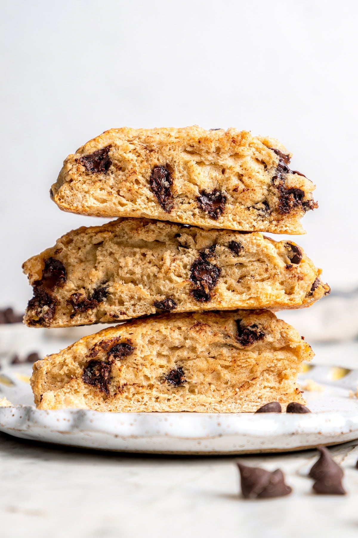 Chocolate chip scones are sweetened to perfection and studded with chocolate chips to make them taste like a treat. An easy no-fail recipe! Stack of 3 chocolate chip scones on plate