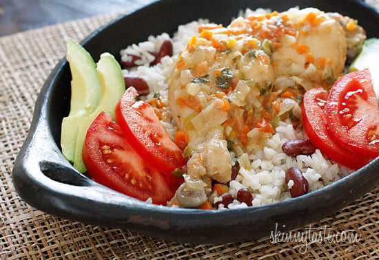Jamaican Brown Stew Chicken – A spicy dish with skinless chicken legs and thighs, simmered in a pot with light coconut milk, scallions, onions, tomatoes, garlic, thyme and one very hot scotch bonnet pepper.