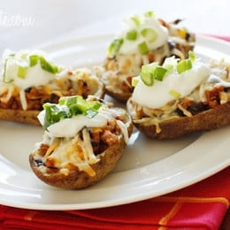 Skinny potato skins loaded Santa Fe style with mildly spiced turkey, black beans, corn and tomatoes topped with cheese - you won't be able to stop at just one!