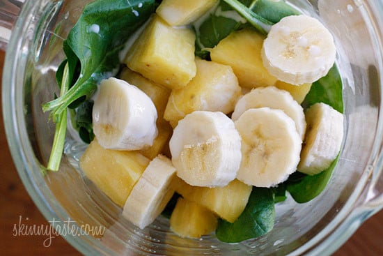 A skinny tropical green smoothie made with pineapple, shredded coconut and bananas, then blended with spinach, light coconut milk and Greek yogurt. High in Vitamin A, B-6, C, Manganese and fiber.