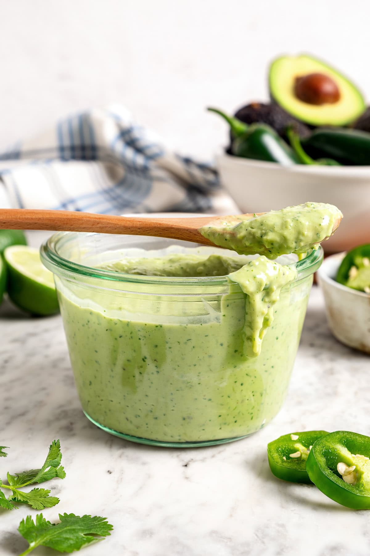 Creamy, bright, and tangy thanks to a buttermilk base, this avocado cilantro lime dressing is perfect for salads, tacos, and dipping veggies. Avocado Cilantro Lime Dressing in glass jar