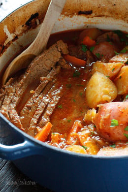 Braised Brisket with Potatoes and Carrots in dutch oven.