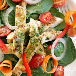 Chicken marinaded with lemon, garlic and oregano, then grilled to perfection and served over a colorful spinach salad. Topped with a white balsamic vinaigrette, does it get better than that?