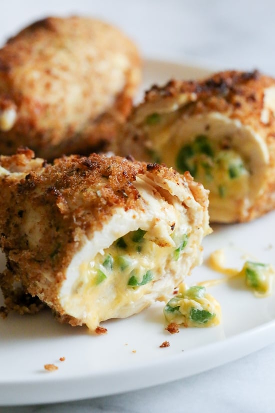What happens when you combine Baked Jalapeño Poppers with chicken?? Oh yeah baby!! Cheesy stuffed chicken breast stuffed with diced jalapeño, cream cheese, cheddar jack cheese, scallions and bacon!