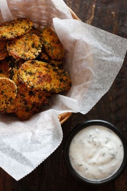 Cornmeal panko herb crusted dill pickles baked in the oven until golden and crisp with a light buttermilk ranch dip. Have you ever had fried pickles?