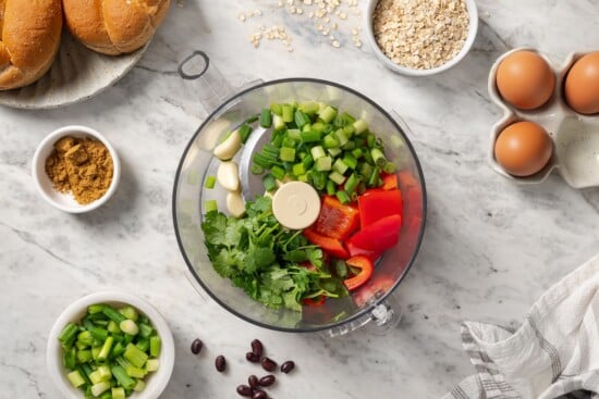 These black bean burgers are flavorful, satisfying and easy to make ahead. With a smoky chipotle mayo and avocado on top, they're delicious! Veggies and cilantro in a food processor.