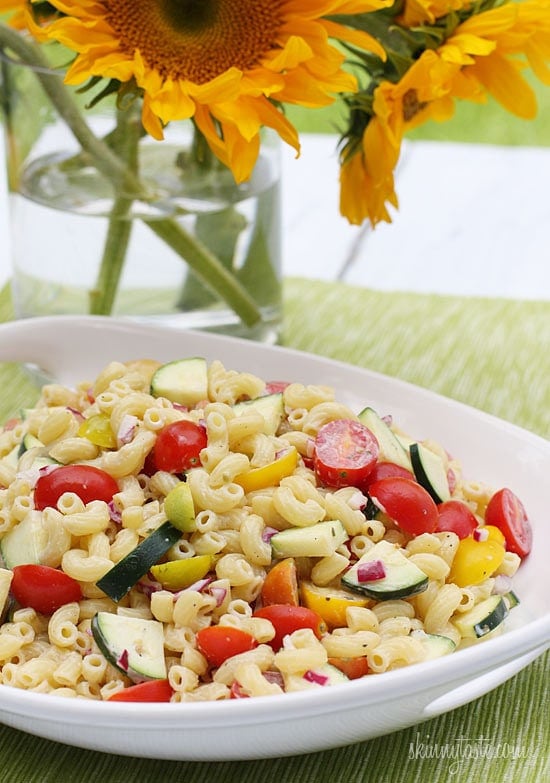 Macaroni Salad with Tomatoes and Zucchini is the perfect summer pasta salad loaded with fresh summer vegetables tossed in a light creamy dressing.