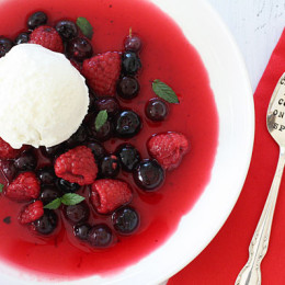 A simple, chilled sweet berry soup topped with fresh berries and mint topped with frozen yogurt. The perfect dessert if you're having company because you make it ahead and keep it chilled until ready to serve.