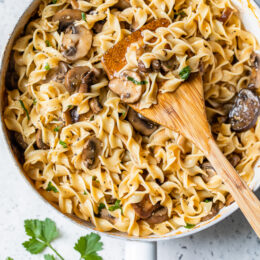 This healthy stroganoff with shiitake, baby portabella, and cremini mushrooms with noodles in a light creamy sauce is a quick and easy meal, perfect for Meatless Mondays!