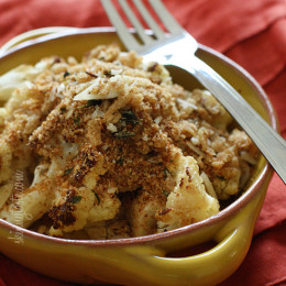 Cauliflower, tossed with a little olive oil, garlic, salt and pepper then roasted in the oven transforms this powerful cruciferous vegetable into a nutty, delicious side dish, especially when topped with toasted bread crumbs.