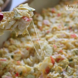 Hot and cheesy imitation crab and artichoke dip is to die for! Serve this glorious dip with baked chips and you will have the perfect appetizer for any party.
