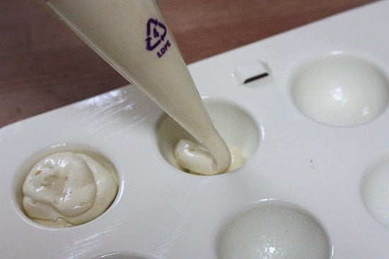 These Skinny Cake pops are made lighter by using a box cake mix, egg whites and fat free Greek yogurt – no oil, no butter required!