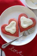 These lightened-up red velvet pancakes are made with a blend of white whole wheat flour and all purpose, then topped with a light cream cheese topping.  I adore red velvet, so I can't think of a more fitting time to make red velvet pancakes, then for Valentine's Day!