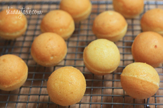 Cooling the baked cake balls on a rack.