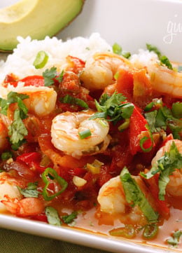 A quick shrimp stew cooked in a tomato coconut broth with a hint of lime and cilantro. Simple enough to make for a weekday dinner yet sophisticated enough to serve to company. Serve with a little brown basmati rice to soak up the broth.