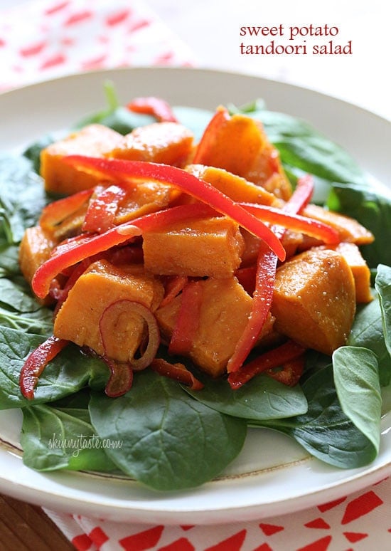 Kumara tandoori salad made of roasted sweet potatoes, seasoned with curry and spices, then tossed with bell peppers, baby spinach and a flavorful vinaigrette.