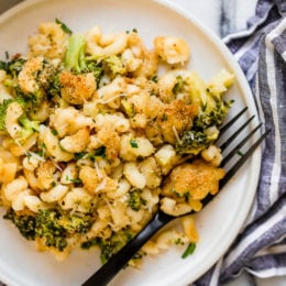Plate of broccoli mac and cheese with fork.