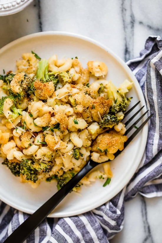 Plate of broccoli mac and cheese with fork.