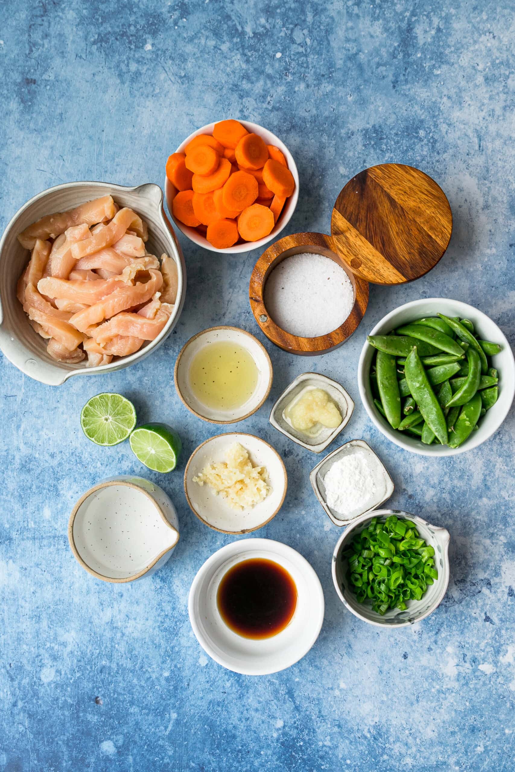 This chicken and vegetable stir fry with snap peas and carrots is sautéed with ginger, lime, and soy sauce. Great for a quick weeknight meal! Chicken and vegetable stir fry ingredients.