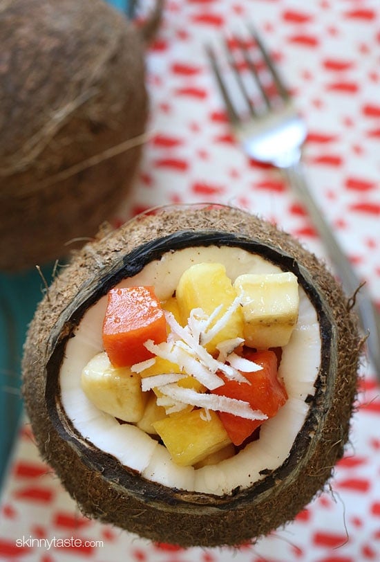 This tropical fruit salad, made with fresh papaya, mango, pineapple, bananas and grated coconut is the best tasting fruit salad... EVER!!