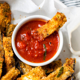 These Baked Eggplant Sticks are breaded with Italian breadcrumbs and Parmesan, baked or air-fried until golden, and served with a quick marinara sauce.