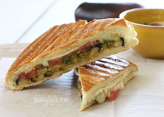 A perfect summer lunch panini made with eggplant, tomatoes, mozzarella and skinny pesto on crispy French bread. Make this for one, or for the whole family.