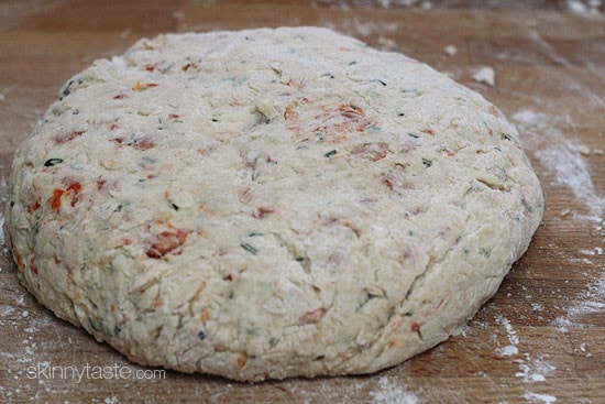 Light and biscuit-like savory scones made with a blend of whole wheat and white flour, shredded zucchini, sun dried tomato, Asiago cheese and fresh rosemary.