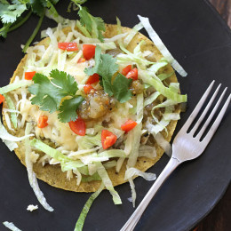 Once in a while, I crave something different for breakfast; something with a little flavor and spice to wake up my taste buds. And that's when Huevos Rancheros land on the menu in my home. But this time, rather than making them the traditional way, I had some tomatillo salsa lying around and I thought why not simmer the eggs in there.
