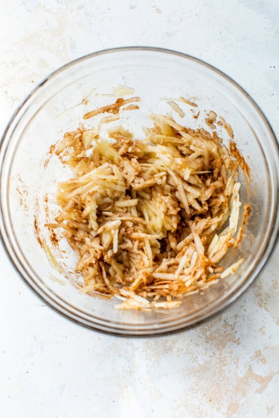 These apple cinnamon muffins are packed with sweet apples, crunchy walnuts, and a hint of spice. Add granola on top for a bit of crunch! shredded apples with cinnamon