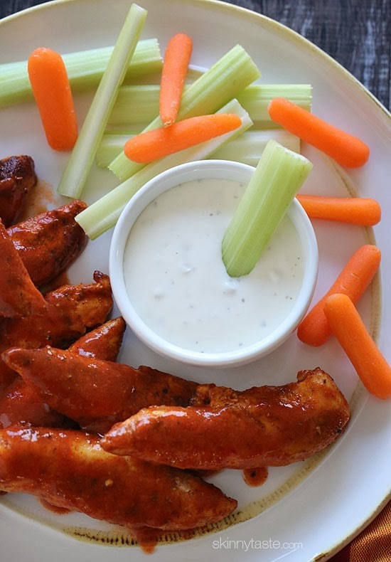 Skinny Buffalo Chicken Strips Less than 10 minutes to make – these chicken tenders are spicy and delicious!